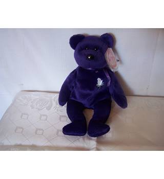 purple ty bear with white rose