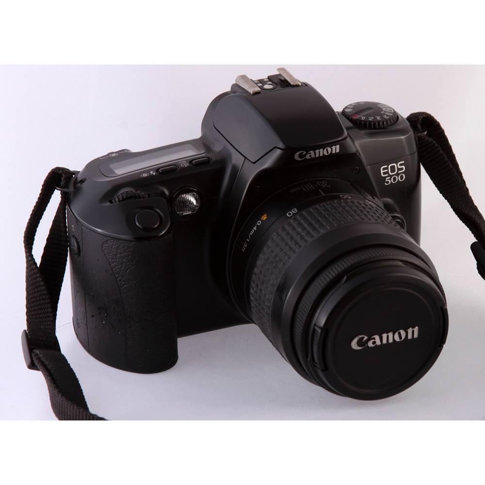 Canon EOS 500 35mm SLR with 3580mm AF F4 zoom lens. Includes camera